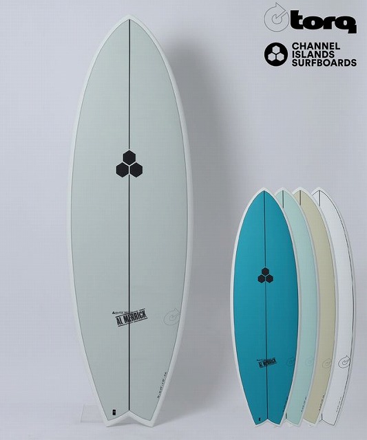 b-bUHciFFA - SHOP NEWS | ムラサキスポーツオンラインストア 通販 Tall light-gray surfboard standing upright with a black honeycomb logo, alongside four smaller teal, blue, cream, and white boards; Torq and Channel Islands logos visible in top-right corner.
