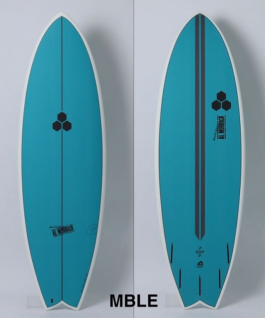 b--hE7TNHw - SHOP NEWS | ムラサキスポーツオンラインストア 通販 Two teal surfboards shown from deck and bottom views side by side, each featuring a black hexagon logo; left shows the deck with a central stringer, right shows the bottom with a dark vertical stripe and fin slots at the tail.