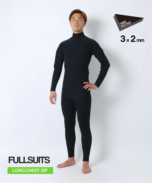 Man wearing a black full-body wetsuit with long sleeves and a high collar, standing with hands on hips; branding shows FULLSUTS and LONG CHEST ZIP.